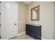 Entryway featuring a decorative mirror, blue chest, and tile flooring at 5313 Greenbrook Dr, Sarasota, FL 34238