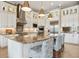 Gourmet kitchen with stainless steel appliances, granite countertops, and custom cabinetry at 5313 Greenbrook Dr, Sarasota, FL 34238
