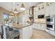 Gourmet kitchen boasts stainless appliances, granite counters, and a large island at 5313 Greenbrook Dr, Sarasota, FL 34238