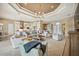 Spacious open-concept living room with modern furnishings and seamless flow to the kitchen and dining areas at 5313 Greenbrook Dr, Sarasota, FL 34238
