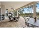 Expansive outdoor area features a seating and dining area with pool and spa at 5313 Greenbrook Dr, Sarasota, FL 34238