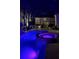 Illuminated pool and spa provides a tranquil oasis at night at 5313 Greenbrook Dr, Sarasota, FL 34238