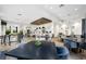 Spacious recreation room with modern furnishings, kitchen, and ample seating, perfect for community gatherings at 5313 Greenbrook Dr, Sarasota, FL 34238