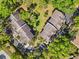 Aerial view of a condo complex surrounded by lush green trees at 5500 Longwood Run Blvd # 201, Sarasota, FL 34243