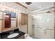 Bathroom featuring a shower with glass door, granite countertop, and recessed lights at 5500 Longwood Run Blvd # 201, Sarasota, FL 34243