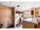 Compact kitchen featuring stainless steel appliances, white cabinets, and functional design at 5500 Longwood Run Blvd # 201, Sarasota, FL 34243