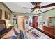 Well-lit bedroom boasts an adjacent bathroom entrance and an exterior door at 5500 Longwood Run Blvd # 201, Sarasota, FL 34243