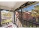 Relaxing screened balcony with privacy blinds and views of surrounding community and water at 5500 Longwood Run Blvd # 201, Sarasota, FL 34243
