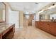 Spacious bathroom featuring double vanity, granite counters, and walk-in shower with decorative tile at 5512 Avenida Del Mare, Sarasota, FL 34242