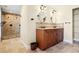 Bathroom with double sink vanity, granite countertop, and tiled walk-in shower at 5512 Avenida Del Mare, Sarasota, FL 34242