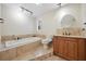 Elegant bathroom with a soaking tub, a built-in tiled tub, and modern fixtures at 5512 Avenida Del Mare, Sarasota, FL 34242