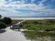 Scenic view of Siesta Beach with white sand, blue skies, and emerald water at 5512 Avenida Del Mare, Sarasota, FL 34242