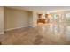 Spacious living area with tile flooring, neutral paint, and seamless flow into the adjacent kitchen at 5512 Avenida Del Mare, Sarasota, FL 34242