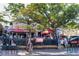 Outdoor restaurant featuring patio seating, and a bustling sidewalk with people at 5512 Avenida Del Mare, Sarasota, FL 34242