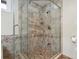 Modern shower featuring stylish tile, a glass enclosure, and dual showerheads, blending luxury with functionality at 5512 Avenida Del Mare, Sarasota, FL 34242