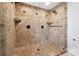 Tiled shower with a glass door and black hardware at 5512 Avenida Del Mare, Sarasota, FL 34242