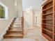 Stairway with hardwood treads and a large picture window that provides natural light at 5512 Avenida Del Mare, Sarasota, FL 34242
