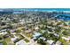 Aerial view of a stylish home with a pool, in a neighborhood close to a bay and the ocean at 5930 Briarwood Ave, Sarasota, FL 34231