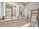 Elegant bathroom features a double vanity with marble countertops, and modern fixtures at 5930 Briarwood Ave, Sarasota, FL 34231