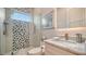 Bathroom featuring a sleek glass shower, decorative tile accents, and a modern vanity at 5930 Briarwood Ave, Sarasota, FL 34231