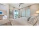 Bright bedroom featuring neutral decor, large windows, and access to a balcony at 5930 Briarwood Ave, Sarasota, FL 34231