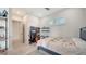 Bright bedroom features light floors, a ceiling fan, and a charming window with plantation shutters at 5930 Briarwood Ave, Sarasota, FL 34231