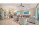 Open-concept living room flows into a kitchen and dining area, with plenty of natural light and modern design at 5930 Briarwood Ave, Sarasota, FL 34231