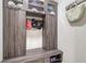 Mud room with seating and storage, featuring custom cabinets, and a spot to hang your hat at 5930 Briarwood Ave, Sarasota, FL 34231