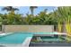 Beautiful pool and spa with a modern design, lush landscaping, and a serene atmosphere at 5930 Briarwood Ave, Sarasota, FL 34231