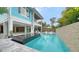 The backyard features a refreshing pool and an open floor plan with plenty of room for seating at 5930 Briarwood Ave, Sarasota, FL 34231
