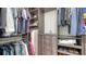Spacious walk-in closet with custom shelving and hanging rods for optimal organization at 5930 Briarwood Ave, Sarasota, FL 34231
