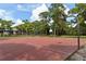 An outdoor basketball court in the park, surrounded by trees at 626 Magellan Dr, Sarasota, FL 34243