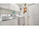 This laundry room features a full size washer and dryer at 626 Magellan Dr, Sarasota, FL 34243