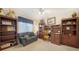 Functional office with a desk, shelves, and sofa; a well-organized work and relaxation space at 626 Magellan Dr, Sarasota, FL 34243
