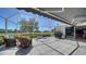 Screened-in patio with a relaxing hot tub and comfortable seating overlooking a green landscape at 626 Magellan Dr, Sarasota, FL 34243