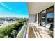 Spacious balcony with seating offers stunning city and water views for relaxing or entertaining at 6415 Midnight Pass Rd # 607, Sarasota, FL 34242