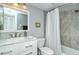 A serene bathroom featuring a marble vanity, modern fixtures, and combined shower and tub at 6415 Midnight Pass Rd # 607, Sarasota, FL 34242