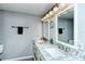 Bathroom featuring a double vanity, marble countertop, and modern fixtures for a spa-like experience at 6415 Midnight Pass Rd # 607, Sarasota, FL 34242