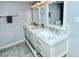 Bathroom featuring a double vanity, marble countertop, and modern fixtures for a spa-like experience at 6415 Midnight Pass Rd # 607, Sarasota, FL 34242
