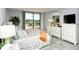 Bright bedroom with a large sliding glass door to a private balcony for fresh air and views at 6415 Midnight Pass Rd # 607, Sarasota, FL 34242