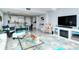 Living room featuring tile floors, a fireplace, stylish furniture, and open views at 6415 Midnight Pass Rd # 607, Sarasota, FL 34242