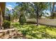Backyard featuring manicured landscaping and privacy walls at 6492 Positano Ct, Sarasota, FL 34243