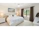 Bright bedroom with plush carpeting and a large window showing natural light, enhancing the room's open feel at 6492 Positano Ct, Sarasota, FL 34243