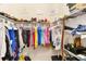 Organized walk-in closet features tiered shelving, creating ample storage for a fashionable wardrobe and accessories at 6492 Positano Ct, Sarasota, FL 34243