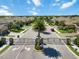 Gated community entrance showing well-manicured landscaping and beautiful homes at 6492 Positano Ct, Sarasota, FL 34243