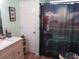 Cozy bathroom features a vanity, full shower/tub, and modern finishes at 705 Blackburn Blvd, North Port, FL 34287