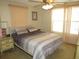 Bedroom with a ceiling fan, and a neutral color palette, creating a serene atmosphere at 705 Blackburn Blvd, North Port, FL 34287