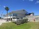 Spacious community building with lush green lawn and inviting outdoor seating areas at 705 Blackburn Blvd, North Port, FL 34287