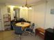 An inviting dining area with round table, seating for four, and soft neutral colors at 705 Blackburn Blvd, North Port, FL 34287