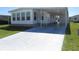 Charming single-story home featuring a driveway and carport, providing ample parking space at 705 Blackburn Blvd, North Port, FL 34287